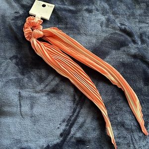 Peach and white hair tie with tail. Brand new with tags